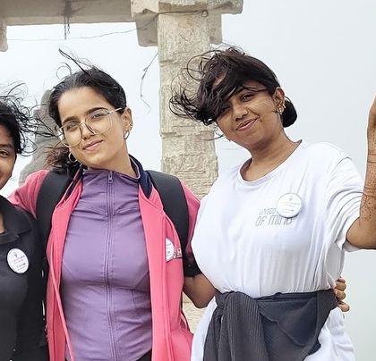 The wind in their hair and smiles on their faces, our trekkers at the top of Savandurga.