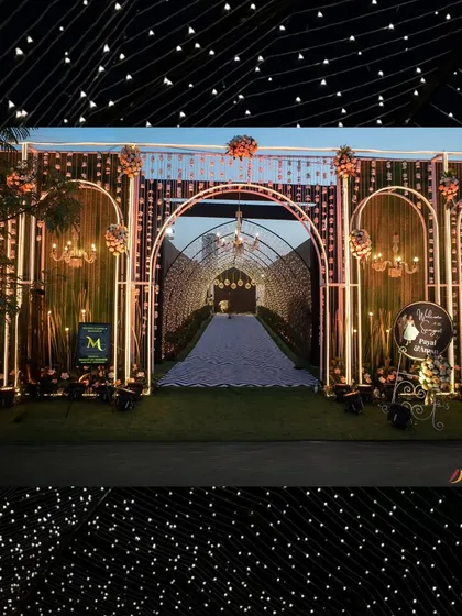The full view of the grand sangeet entrance. The illuminated arches and starlit tunnel create a spectacular first impression, promising a night of glamour and celebration.