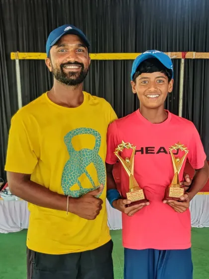 Another coach from the team celebrating with Rishikesh.
