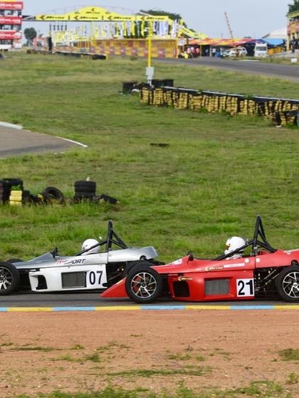 Wheel-to-wheel action in the JK Tyre Formula LGB Championship, as our driver Mihir Avalakki in car 21 overtakes a competitor.