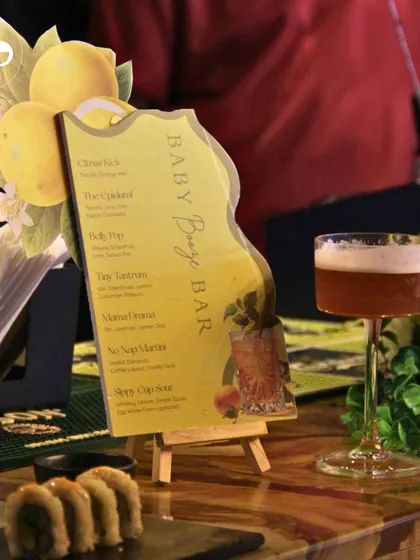 A close-up of the custom-shaped bar menu, showing the creative and thematic stationery I can design for your event.