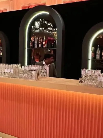 Another angle of the striking orange bar, showing how it fits into the larger event space. We design our bars to be both highly functional and a key part of the overall aesthetic.