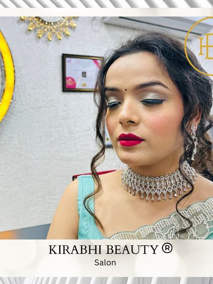 A glamorous party look with a silver cut-crease eyeshadow and a bold red lip. This is for someone who wants to make a statement at their event.