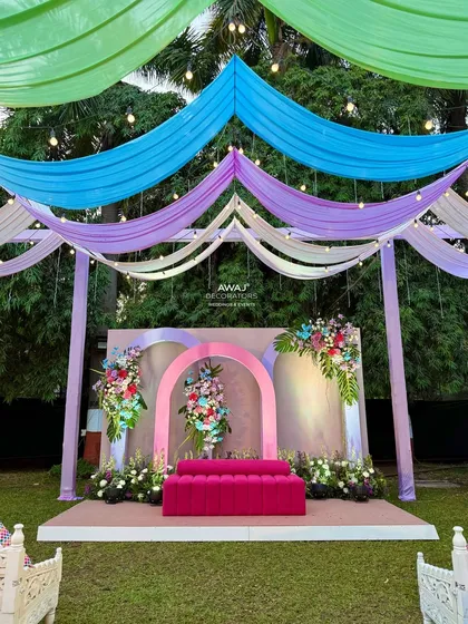 Another angle of the pastel stage, set against a backdrop of lush greenery.