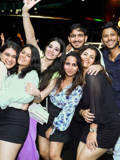 A happy group posing for a photo. The party brings everyone together.