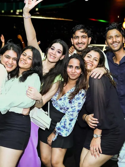 A happy group posing for a photo. The party brings everyone together.
