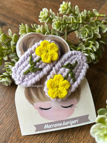 These hairpins feature bright yellow flowers on a lavender base. The color combination is cheerful and perfect for spring and summer looks.
