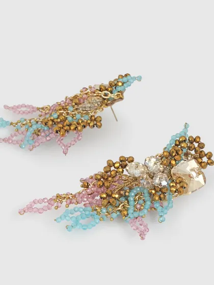 A side view of our pink and blue danglers, showing the mix of crystal beads and gold-plated chains.