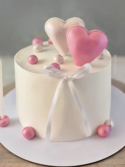 A romantic anniversary cake in my seasonal Fresh Strawberry Mango Vanilla flavour, adorned with edible balloon hearts.