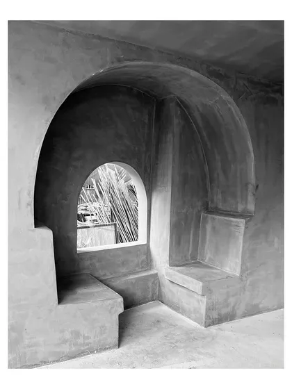 A work-in-progress shot of sculpted concrete alcoves for a housing lobby in Kolhapur. These intimate seating areas are designed to transform a simple waiting space into a more engaging and comfortable experience.