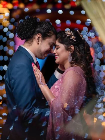 An intimate portrait of a couple at their reception, surrounded by beautiful fairy lights. We specialize in creating this magical bokeh effect.