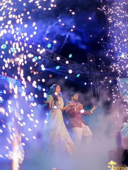 A high-energy dance performance on a big stage. My engagement videography captures the fun and celebration with dynamic shots and vibrant lighting.