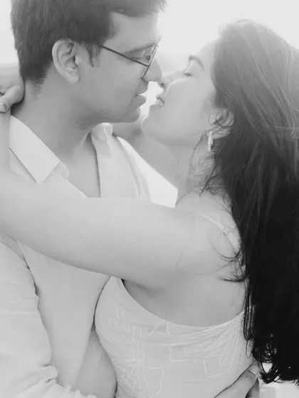 A tight, intimate black and white shot of Ritu and Tarush. By focusing closely on their faces, I captured the raw emotion and connection in this quiet moment, away from any distractions.