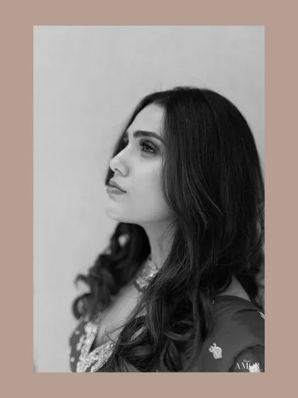 A classic black and white profile portrait of the bride, exuding elegance and grace.
