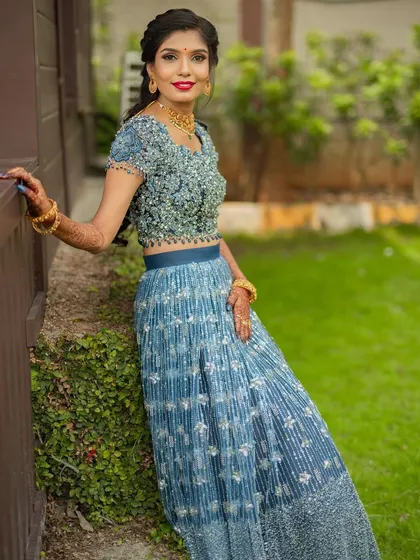 A full length shot of the engagement look. The makeup features a bright, happy lip color and defined eyes that stand out beautifully in natural light.