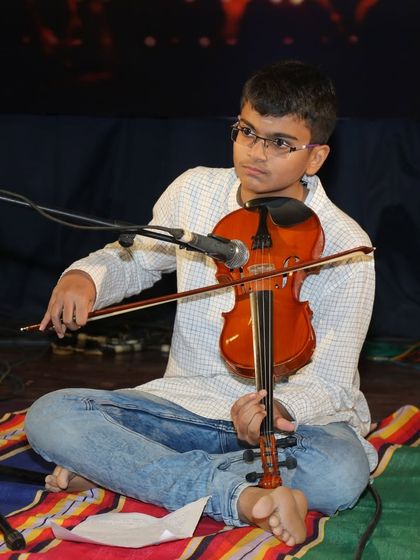 A moment of concentration as Amogh prepares to play a complex passage.