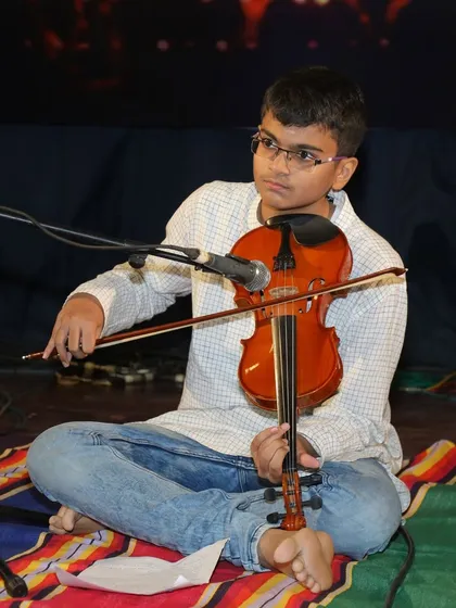 A moment of concentration as Amogh prepares to play a complex passage.