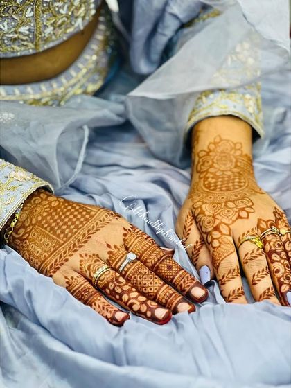 Another angle of the guest's mehendi, showing the delicate details on the fingers and wrist.