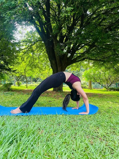A day started well. A beautiful wheel pose in the park. Practicing on the grass connects me to the earth's energy.