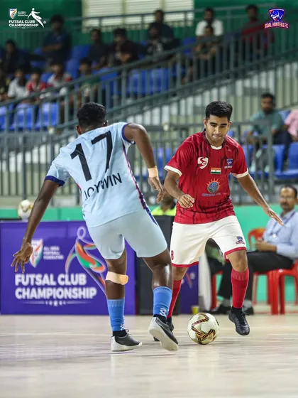 A player dribbling past his opponent in the quarter-final match.