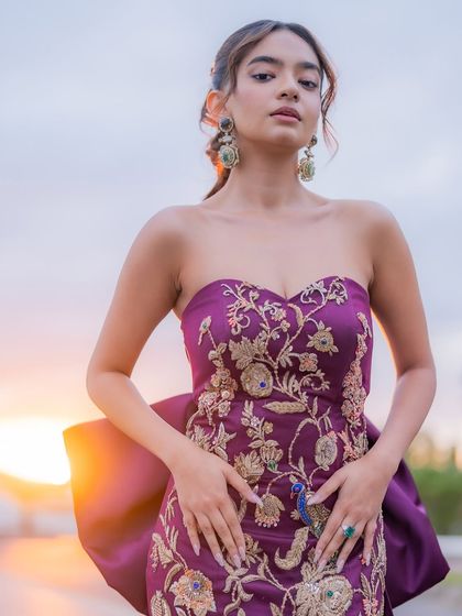 Another stunning portrait of Anushka Sen in her purple Cannes gown, with the sunset creating a beautiful golden glow.