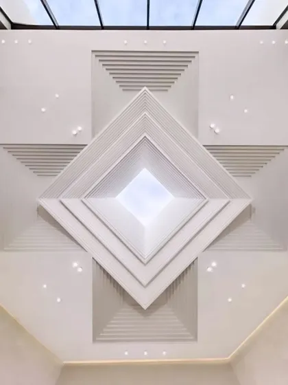 A stunning example of a multi-layered POP ceiling that creates an incredible sense of depth. The pyramid-like geometric design draws the eye upward, making it a powerful architectural statement.