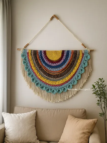 This handcrafted semi-circular wall hanging combines intricate macramé knotting with colorful crochet layers. It's a true statement piece, perfect for bringing a vibrant, bohemian feel to any living room or entryway.