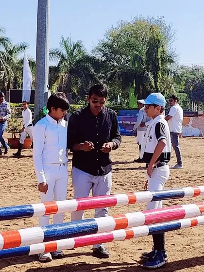 Explaining the course details to my riders before the competition. Understanding the track is as important as the ride itself, and we prepare for every detail.