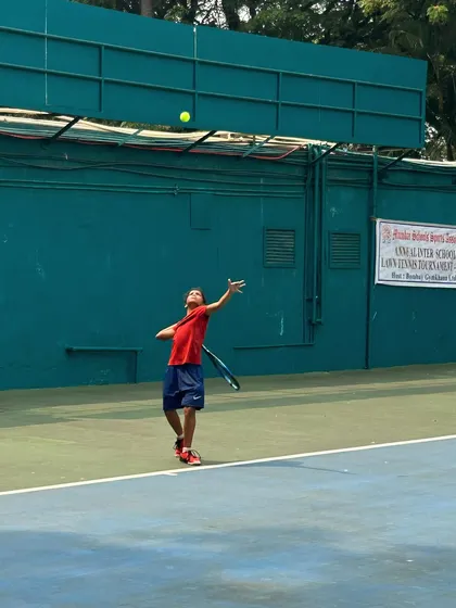 A young player executes a perfect serve toss during the MSSA tournament finals.