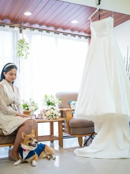 A unique getting-ready photo, featuring the bride with her beautifully dressed corgi. It’s a sweet and personal touch that shows what’s important to her.