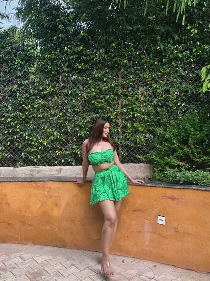 A green tropical print co-ord set with a bandeau top and shorts, perfect for a staycation.
