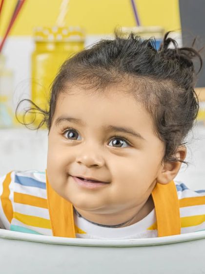 A sweet, curious expression from this little one. These simple portraits really let their personality shine.