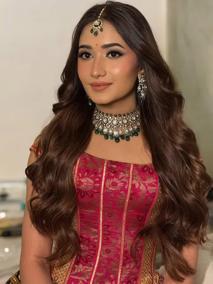 Another beautiful portrait of the bride, showcasing the timeless appeal of a classic wavy hairstyle for an engagement or Roka.