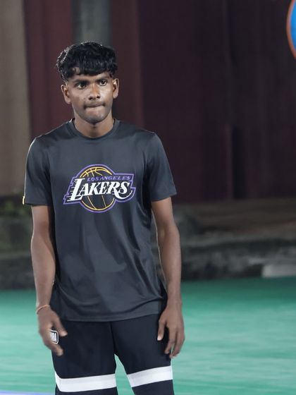 A portrait of one of our dedicated coaches, focused and ready to lead. Our coaching staff is the backbone of the academy.