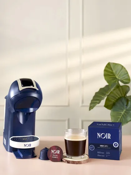 A clean and professional product shot for Noir, a coffee brand. This image demonstrates my skill in art direction and styling for e-commerce and advertising, creating a sophisticated look that highlights the product and its packaging.