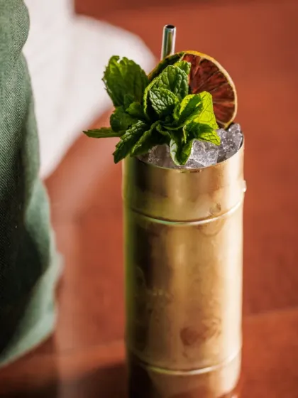 A refreshing summer cooler served in a metallic glass with crushed ice and a generous mint garnish. Perfect for daytime events and sundowners.
