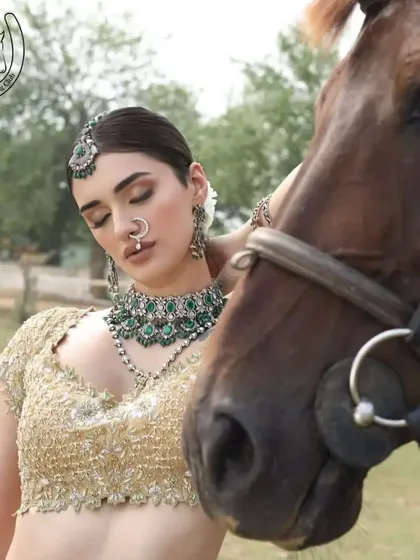 An artistic and emotional portrait of a model and horse, perfect for high-end editorial or bridal photography.