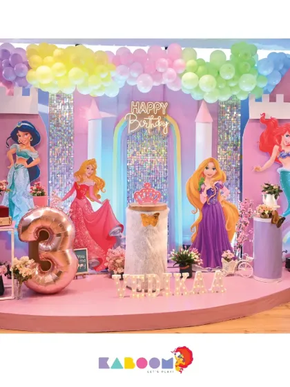 A grand castle for your little princess! This Disney Princess theme brings together Jasmine, Aurora, Rapunzel, and Ariel in a pastel palace setting with shimmering towers and a large number three balloon.
