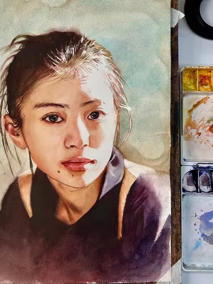 The portrait demonstration on my easel, with the messy, beautiful palette right beside it. This shows the real, unedited process of creating art.