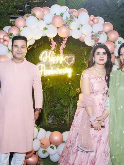Friends and family gather to celebrate a special milestone at an anniversary party. I cover couple-focused events and make sure to get great group photos.