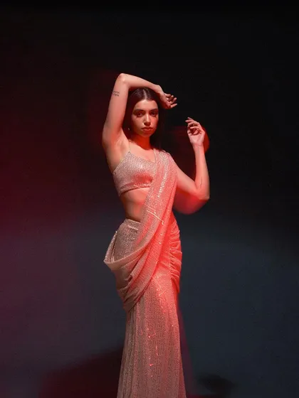 A dynamic pose with a slow-shutter effect, creating a sense of movement and energy. This technique adds an artistic flair to the fashion shot, making it visually captivating.