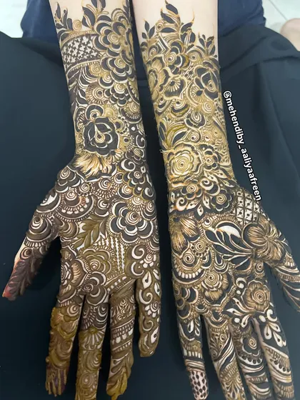 The complete view of this heavy design, perfect for anyone who loves a full "bhari hui" mehendi look.