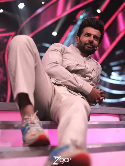 A low-angle shot emphasizing the modern yet comfortable feel of Jay Bhanushali's outfit. The combination of traditional design with casual footwear shows its versatility.