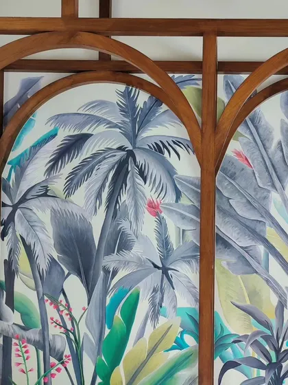 A duplicate image of the mural seen through the arches.