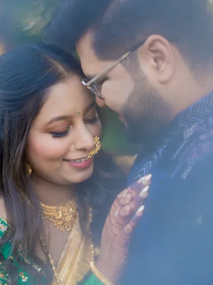 A soft, romantic close-up of Nishant and Namrata. This style of portrait focuses on the quiet connection and emotion between a couple, capturing the genuine smiles and gentle moments before the wedding day.