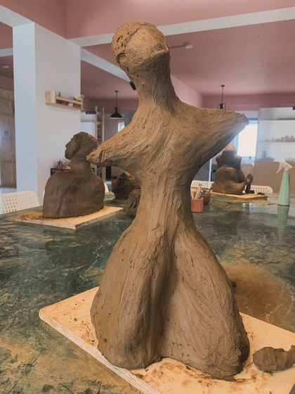 An abstract sculpture created by a student during our workshop. The organic, flowing form is a testament to the creative freedom that clay offers.