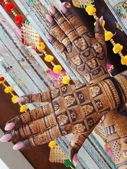 A full-hand design with a heavy grid pattern, giving it a very modern and structured look.