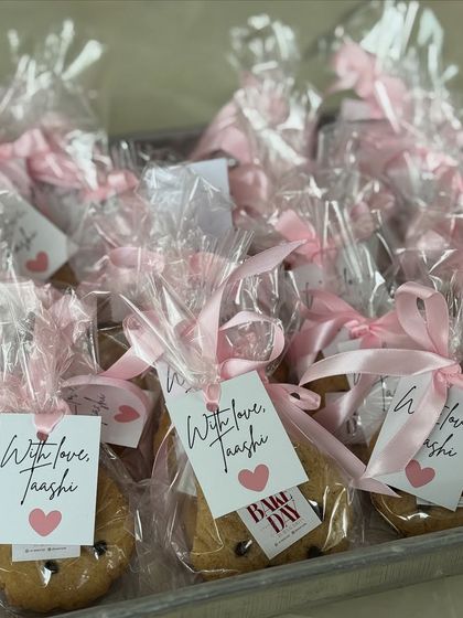 A tray of our individually wrapped cookies, tied with pink ribbons and personalized tags. They make the perfect take-home treat for guests.