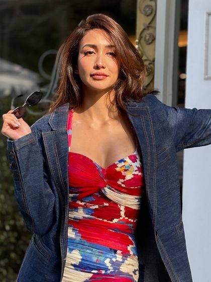 A confident and stylish shot of the client with her modern, wavy hairstyle.