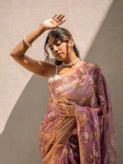 A beautiful, dreamy shot from a saree photoshoot. The makeup is soft and romantic to match the floral organza saree.